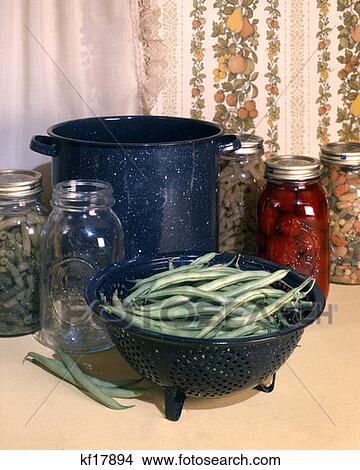 Retro Tabletop Canning String Beans In Glass Jars Blue Enamel Pot And Colander View Large Photo Image Picture - Retro Tabletop Canning String Beans In Glass Jars Blue Enamel Pot And Colander. Fotosearch