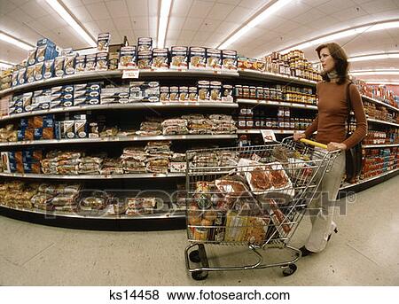 Retro Woman 1970 1970S Grocery Shopping Pushing Cart View Large Photo Image Stock Photo - Retro Woman 1970 1970S Grocery Shopping Pushing Cart. Fotosearch