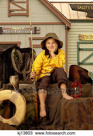 Smiling Boy Wearing Raincoat Canvas Hat Holding Fishing Pole Sitting On Fishing Wharf View Large Photo Image Stock Image - Smiling Boy Wearing Raincoat Canvas Hat Holding Fishing Pole Sitting On Fishing Wharf . Fotosearch