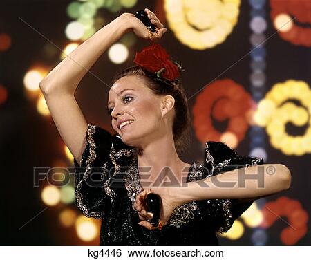 Spanish Latin Flamenco Dancer Woman With Castanets Musical Instrument Wild Fast Black Frilly Dress Studio Indoor Proud View Large Photo Image Stock Photograph - Spanish Latin Flamenco Dancer Woman With Castanets Musical Instrument Wild Fast Black Frilly Dress Studio Indoor Proud . Fotosearch