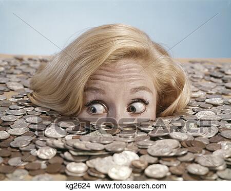 Startled Looking Young Woman Peeping Up Over Great Pile Of Coins Rolling Her Eyes Studio View Large Photo Image Picture - Startled Looking Young Woman Peeping Up Over Great Pile Of Coins Rolling Her Eyes Studio . Fotosearch