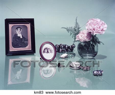 Tabletop Still Life Framed Sepia Photo Of Woman Vase Of Carnations Ring Watch Jewelry Photo Of Two Children View Large Photo Image Stock Image - Tabletop Still Life Framed Sepia Photo Of Woman Vase Of Carnations Ring Watch Jewelry Photo Of Two Children . Fotosearch