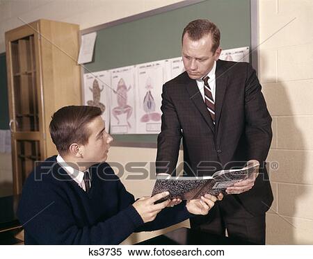 Teacher And Student Reviwing Notes In Science Classroom View Large Photo Image Stock Photography - Teacher And Student Reviwing Notes In Science Classroom. Fotosearch