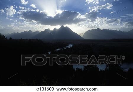 Teton National Park, Wy Sun'S Rays Over Grand Teton At Sunset Snake River Overlook View Large Photo Image Stock Photo - Teton National Park, Wy Sun'S Rays Over Grand Teton At Sunset Snake River Overlook. Fotosearch