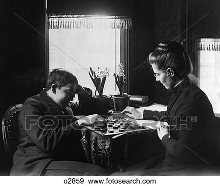 Turn Of The Century Couple Playing Checkers View Large Photo Image Stock Photo - Turn Of The Century Couple Playing Checkers . Fotosearch