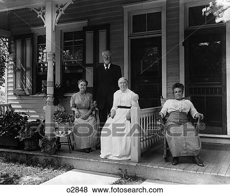 Turn Of The Century Group Of Four Neighbors Sitting On The Porch Of A Duplex View Large Photo Image Stock Photo - Turn Of The Century Group Of Four Neighbors Sitting On The Porch Of A Duplex . Fotosearch
