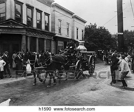 Turn Of The Century Horse-Drawn Fire Truck Parading Through Town With People Lining Streets View Large Photo Image Stock Image - Turn Of The Century Horse-Drawn Fire Truck Parading Through Town With People Lining Streets . Fotosearch