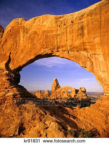 Turret Arch Seen Through North Window At Sunrise Arches National Park, Utah View Large Photo Image Stock Image - Turret Arch Seen Through North Window At Sunrise Arches National Park, Utah. Fotosearch