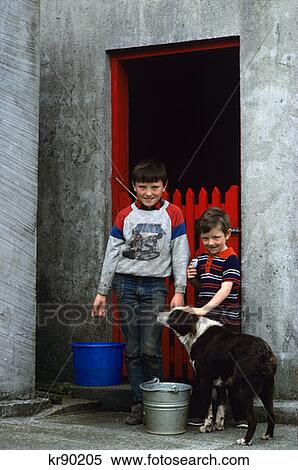 Two Boys By Red Barn Door With Buckets And Dog Killybegs, County Donegal, Ireland View Large Photo Image Stock Photography - Two Boys By Red Barn Door With Buckets And Dog Killybegs, County Donegal, Ireland. Fotosearch