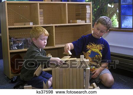 Two Boys Playing With Blocks In Preschool Classroom View Large Photo Image Stock Photo - Two Boys Playing With Blocks In Preschool Classroom . Fotosearch