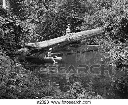 Stock Image - Two Boys Wearing Hats Fishing In A Stream. Fotosearch