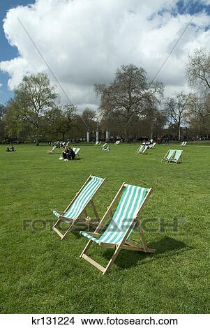 Picture - Two Empty Lawn Chairs In London Park. Fotosearch
