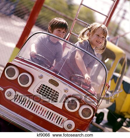 Two Little Kids Children Boy Girl Driving Playing Toy Bus Car Firetruck Fire Engine Ride 1970 1970S Retro View Large Photo Image Stock Photograph - Two Little Kids Children Boy Girl Driving Playing Toy Bus Car Firetruck Fire Engine Ride 1970 1970S Retro . Fotosearch