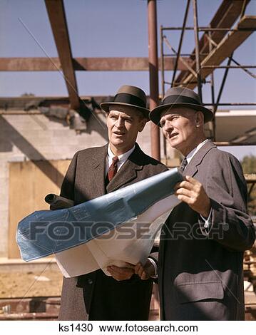 Two Men With Blueprints At Construction Site View Large Photo Image Stock Image - Two Men With Blueprints At Construction Site . Fotosearch