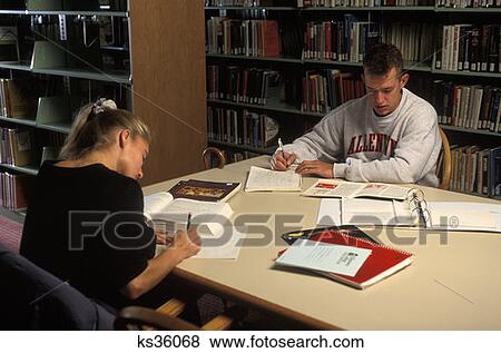 Two Students Working In College Library  View Large Photo Image Stock Photo - Two Students Working In College Library . Fotosearch