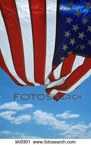 Unusual Angle Of Usa American Flag Flags Waving In The Wind With Blue Sky Clouds Patriotic Patriotism Freedom Liberty View Large Photo Image Stock Image - Unusual Angle Of Usa American Flag Flags Waving In The Wind With Blue Sky Clouds Patriotic Patriotism Freedom Liberty. Fotosearch