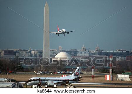 Washington Dc Plane Taking Off From National Airport With Washington Monument In Background View Large Photo Image Picture - Washington Dc Plane Taking Off From National Airport With Washington Monument In Background . Fotosearch