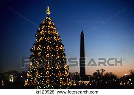 Stock Photo - Washington Dc Washington Monument And Christmas Tree At Sunset . Fotosearch
