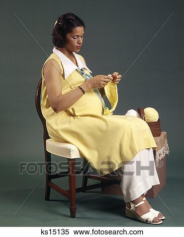 Woman Knitting Needle Pregnant 1970S 1977 Yarn Sitting View Large Photo Image Stock Photography - Woman Knitting Needle Pregnant 1970S 1977 Yarn Sitting. Fotosearch