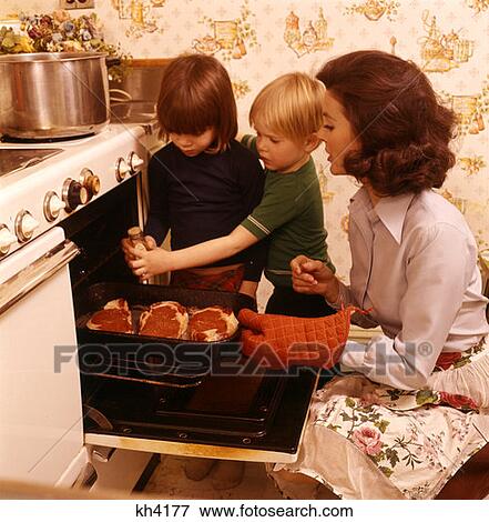 Woman Mother Children Sons Cooking Stove Oven 1970 1970S Retro View Large Photo Image Stock Photo - Woman Mother Children Sons Cooking Stove Oven 1970 1970S Retro . Fotosearch