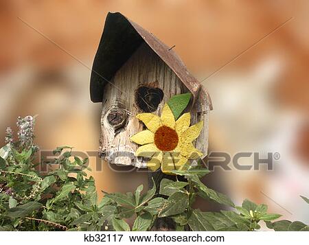 Wooden Birdhouse With Overhanging Tin Roof And Sunflower Decoration View Large Photo Image Stock Photo - Wooden Birdhouse With Overhanging Tin Roof And Sunflower Decoration . Fotosearch