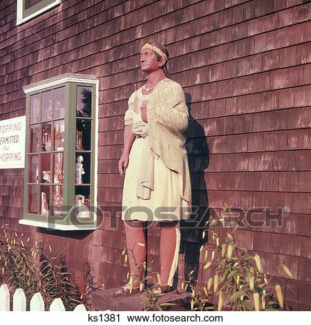 Stock Image - Wooden Indian Statue Outside Of Store Provincetown, Massachusetts. Fotosearch