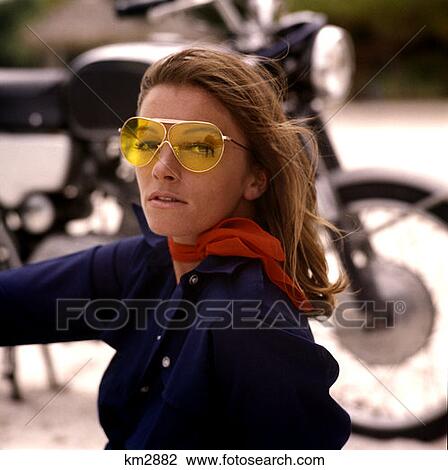 Young Brunette Motocyclist Yellow Sunglasses Red Scarf Mod 1970 1970S Retro View Large Photo Image Stock Image - Young Brunette Motocyclist Yellow Sunglasses Red Scarf Mod 1970 1970S Retro . Fotosearch