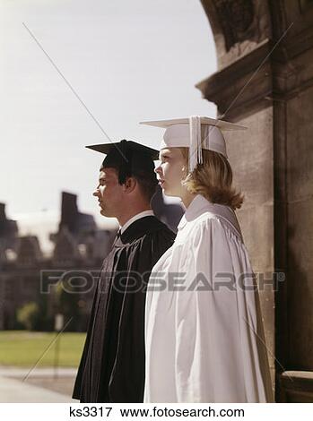 Young Man & Woman In Graduation Gowns View Large Photo Image Stock Photo - Young Man & Woman In Graduation Gowns. Fotosearch