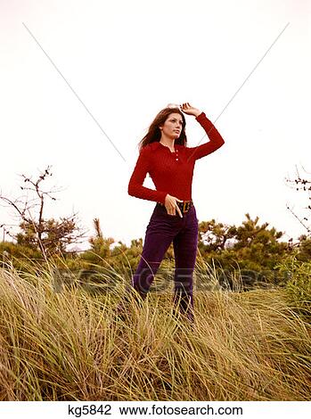 Young Woman Girl Glamour Red Blouse Denim Jeans Field Sunglasses 1970 1970S Retro View Large Photo Image Stock Image - Young Woman Girl Glamour Red Blouse Denim Jeans Field Sunglasses 1970 1970S Retro . Fotosearch