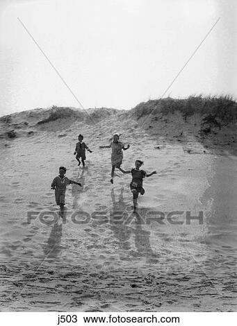 1920 1920S 1930 1930S 4 Kids 2 Boys 2 Girls Running Down Sand Dune Summer Playing Boy Girl Shore Retro View Large Photo Image Stock Image - 1920 1920S 1930 1930S 4 Kids 2 Boys 2 Girls Running Down Sand Dune Summer Playing Boy Girl Shore Retro . Fotosearch