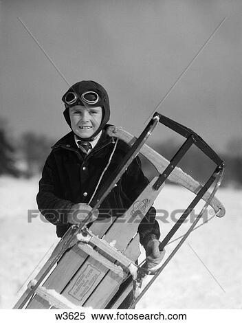 1920 1920S 1930 1930S Boy Holding Sled Goggles On Forehead View Large Photo Image Stock Photography - 1920 1920S 1930 1930S Boy Holding Sled Goggles On Forehead . Fotosearch