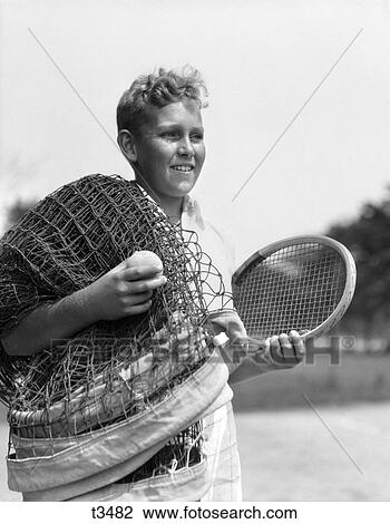 1920 1920S 1930 1930S Boy Tennis Player Holding Racket Net And Ball View Large Photo Image Stock Image - 1920 1920S 1930 1930S Boy Tennis Player Holding Racket Net And Ball . Fotosearch