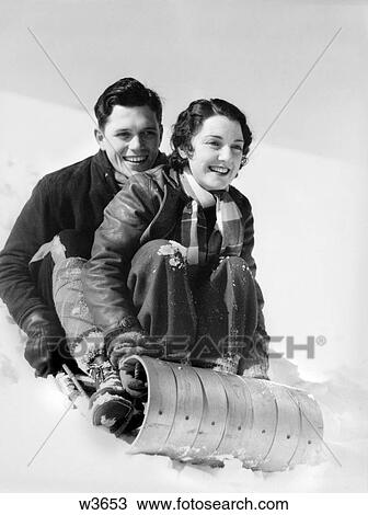 1920 1920S 1930 1930S Couple On Sled In Winter View Large Photo Image Stock Image - 1920 1920S 1930 1930S Couple On Sled In Winter . Fotosearch