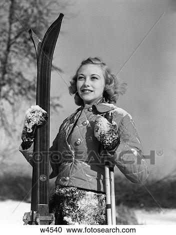 1920 1920S 1930 1930S Girl Standing Holding Skis And Poles Smiling View Large Photo Image Stock Image - 1920 1920S 1930 1930S Girl Standing Holding Skis And Poles Smiling . Fotosearch