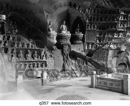 Stock Photo - 1920 1920S 1930 1930S Interior Scene In The Cave Of The Thousand 1000 Buddhas Hangchow China Buddhism Religion Rrr Retro. Fotosearch