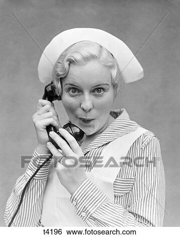 1920 1920S 1930 1930S Nurse Talking On Telephone View Large Photo Image Stock Photograph - 1920 1920S 1930 1930S Nurse Talking On Telephone . Fotosearch