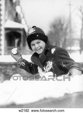 1920S 1920 1930 1930S Smiling Boy About To Throw Toss Snowball Playing Snow Fun Winter Cold Mischief Retro View Large Photo Image Stock Image - 1920S 1920 1930 1930S Smiling Boy About To Throw Toss Snowball Playing Snow Fun Winter Cold Mischief Retro . Fotosearch