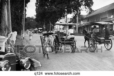 19s 1930s 19 年 1930 Batavia 雅加達 Java 印尼 街道場景 馬 推車圖片 Q124 Fotosearch