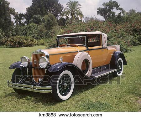 1920S 1930S Cadillac Convertible Roadster Yellow And Black With Whitewall Tires Vintage Antique View Large Photo Image Stock Photo - 1920S 1930S Cadillac Convertible Roadster Yellow And Black With Whitewall Tires Vintage Antique . Fotosearch