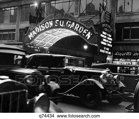 1920S 1930S Cars Taxi Madison Square Garden Marquee At Night Hockey New York City Nyc Liggett Drugstore Manhattan Ny Retro View Large Photo Image Picture - 1920S 1930S Cars Taxi Madison Square Garden Marquee At Night Hockey New York City Nyc Liggett Drugstore Manhattan Ny Retro. Fotosearch