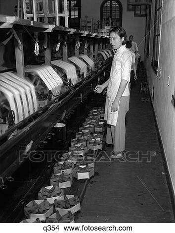 Picture - 1920S 1930S Chinese Woman Silk Factory Worker At Winding Machines Spools Of Silk Thread Textile . Fotosearch