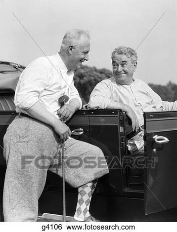 1920S 1930S Elderly Man Leaning On Running Board Of Car Holding Golf Club & Talking To Another Man Sitting In The Car View Large Photo Image Stock Photograph - 1920S 1930S Elderly Man Leaning On Running Board Of Car Holding Golf Club & Talking To Another Man Sitting In The Car . Fotosearch
