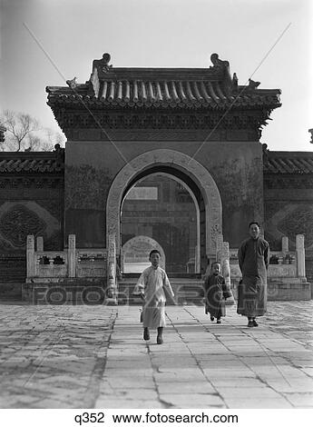 1920S 1930S Man 2 Children Boys Walking From Temple Gateway Arch Winter Palace Peking Beijing China View Large Photo Image Stock Image - 1920S 1930S Man 2 Children Boys Walking From Temple Gateway Arch Winter Palace Peking Beijing China . Fotosearch