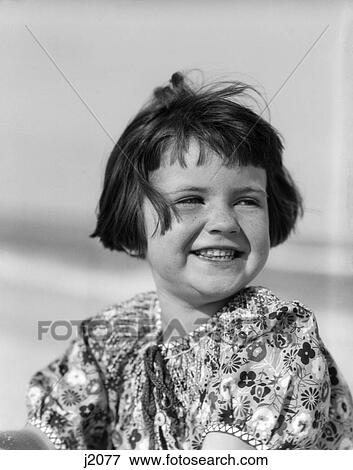 1920S 1930S Portrait Smiling Brunette Girl Bobbed Windblown Hair Peasant Blouse View Large Photo Image Stock Photo - 1920S 1930S Portrait Smiling Brunette Girl Bobbed Windblown Hair Peasant Blouse . Fotosearch
