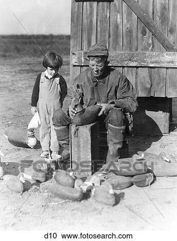1920S 1930S Small Boy Watching Older Man Assemble Duck Decoys View Large Photo Image Stock Image - 1920S 1930S Small Boy Watching Older Man Assemble Duck Decoys. Fotosearch