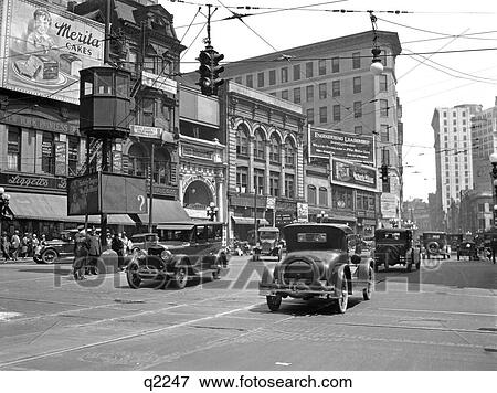 1920S Busy Five Points Intersection In Atlanta Georgia With Automobile & Pedestrian Traffic View Large Photo Image Stock Photo - 1920S Busy Five Points Intersection In Atlanta Georgia With Automobile & Pedestrian Traffic . Fotosearch