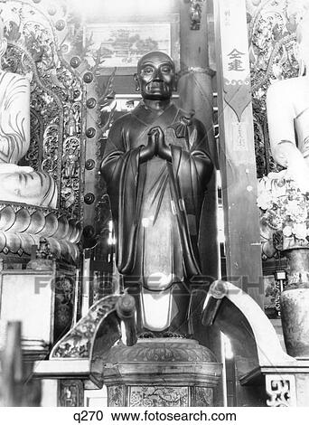 Stock Image - 1920S Carved Wood Effigy Statue Of The Buddha In A Chinese Temple Antique Buddhist Religion Buddhism . Fotosearch