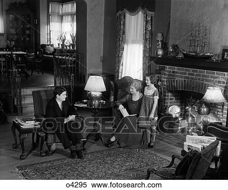 1920S Family Mother Father Child Daughter Sit Living Room Study Social Read Talk Fireplace Rug Affluent View Large Photo Image Stock Photography - 1920S Family Mother Father Child Daughter Sit Living Room Study Social Read Talk Fireplace Rug Affluent . Fotosearch