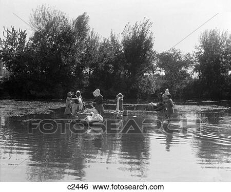 1920S Group Of Women In Costume Of Rural France Doing Laundry In A Stream Or River Near Marseilles France View Large Photo Image Stock Photograph - 1920S Group Of Women In Costume Of Rural France Doing Laundry In A Stream Or River Near Marseilles France. Fotosearch