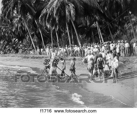 1920S Movie Crew With Cameras On Tripods In Surf On Tropical Beach View Large Photo Image Stock Photograph - 1920S Movie Crew With Cameras On Tripods In Surf On Tropical Beach . Fotosearch